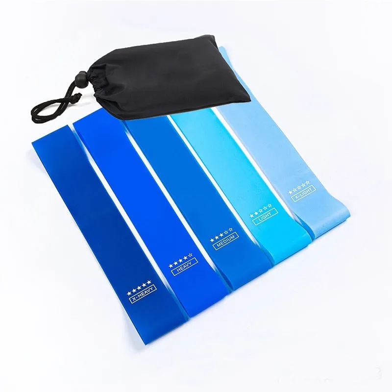 Five colour-coded TPE yoga tension straps with force marks arranged by thickness from 0.5mm to 1.1mm