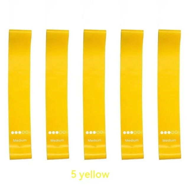 Five colour-coded TPE yoga tension straps with force marks arranged by thickness from 0.5mm to 1.1mm