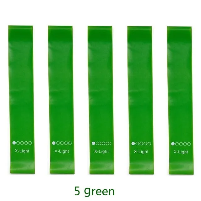 Five colour-coded TPE yoga tension straps with force marks arranged by thickness from 0.5mm to 1.1mm