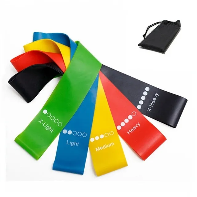 Five colour-coded TPE yoga tension straps with force marks arranged by thickness from 0.5mm to 1.1mm