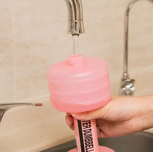 Water-filled fitness dumbbell for women in pink polypropylene plastic with leak-proof port