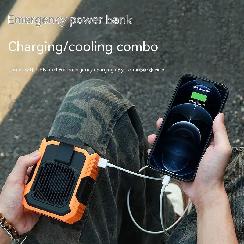 Green wrist hanging personal fan with light and USB charging port on a compact ABS and silicone body.