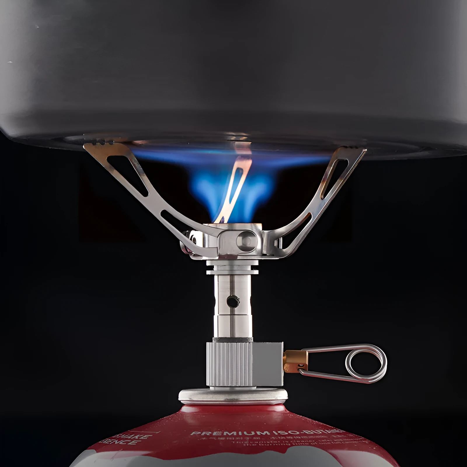 Portable folding mini camping stove in unfolded position showing 3000W burner and anti-skid bracket