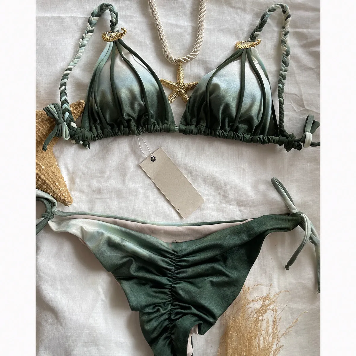 Tie-dyed bikini set in green with high-waist backless briefs on a woman by the seaside