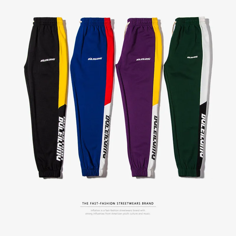 Spring men's casual slim fit sweatpants in black and white printed polyester with zippered pockets and drawstring waist