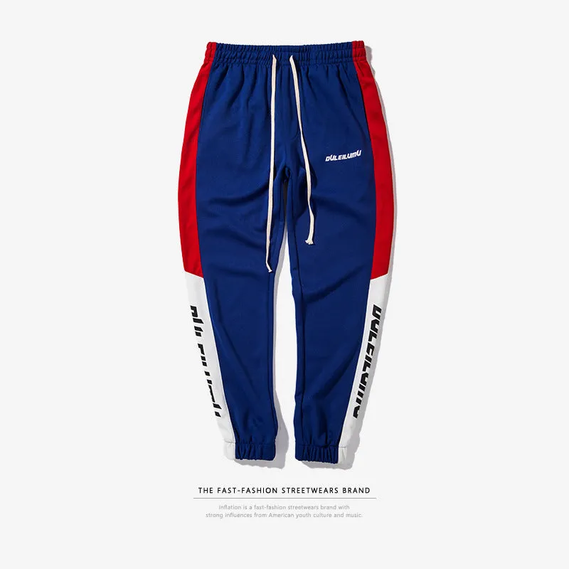 Spring men's casual slim fit sweatpants in black and white printed polyester with zippered pockets and drawstring waist