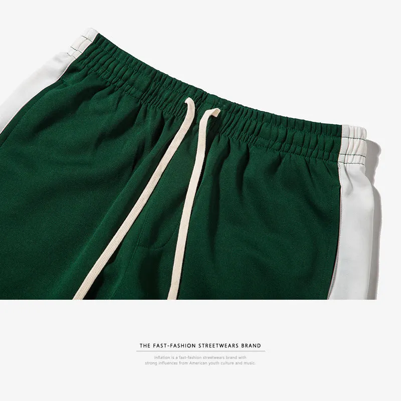 Spring men's casual slim fit sweatpants in black and white printed polyester with zippered pockets and drawstring waist