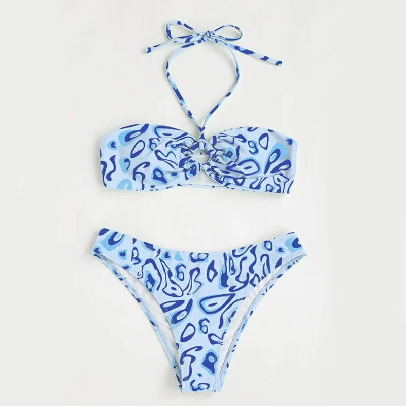 Women's blue floral bandeau bikini swimsuit with split style design on mannequin