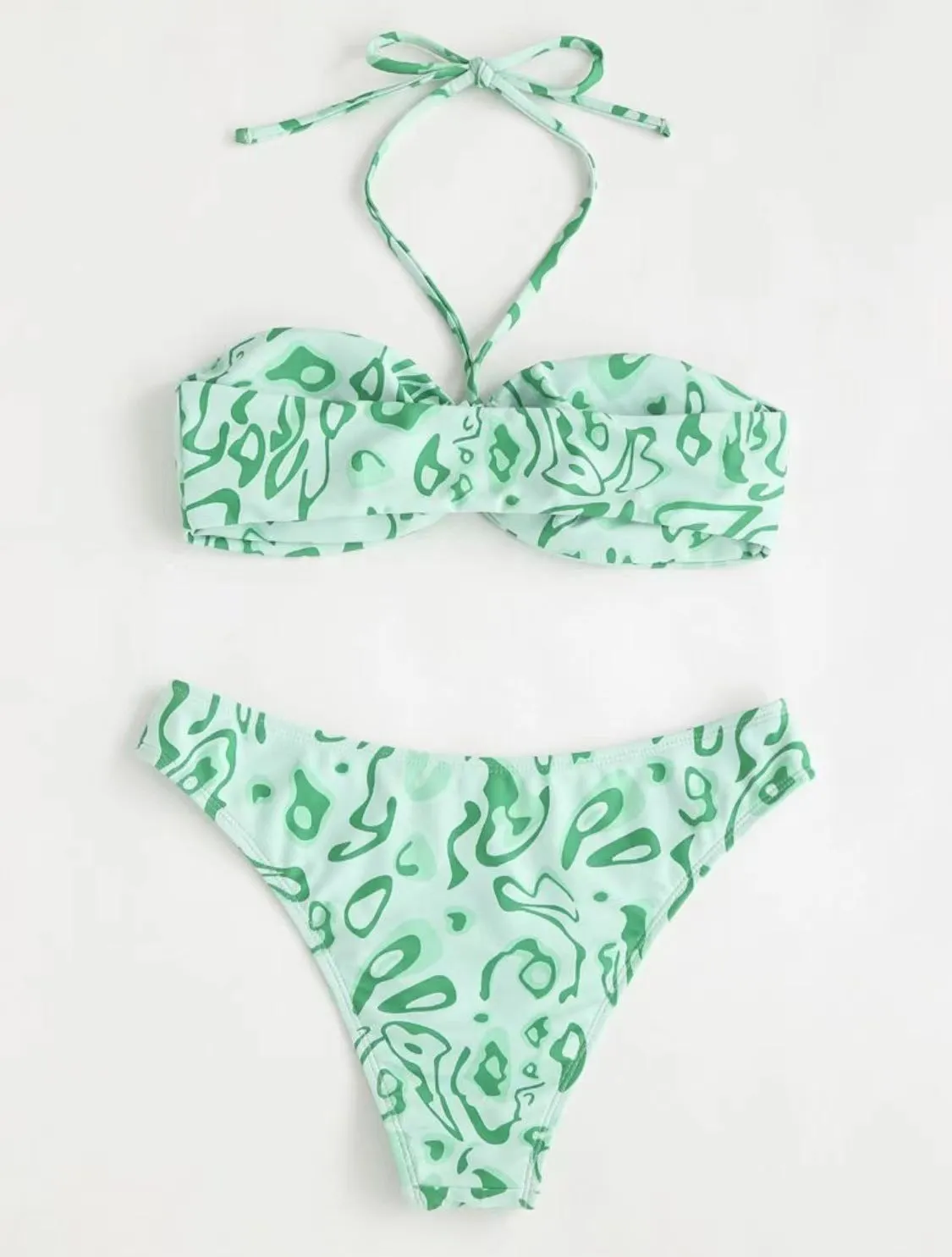 Women's blue floral bandeau bikini swimsuit with split style design on mannequin