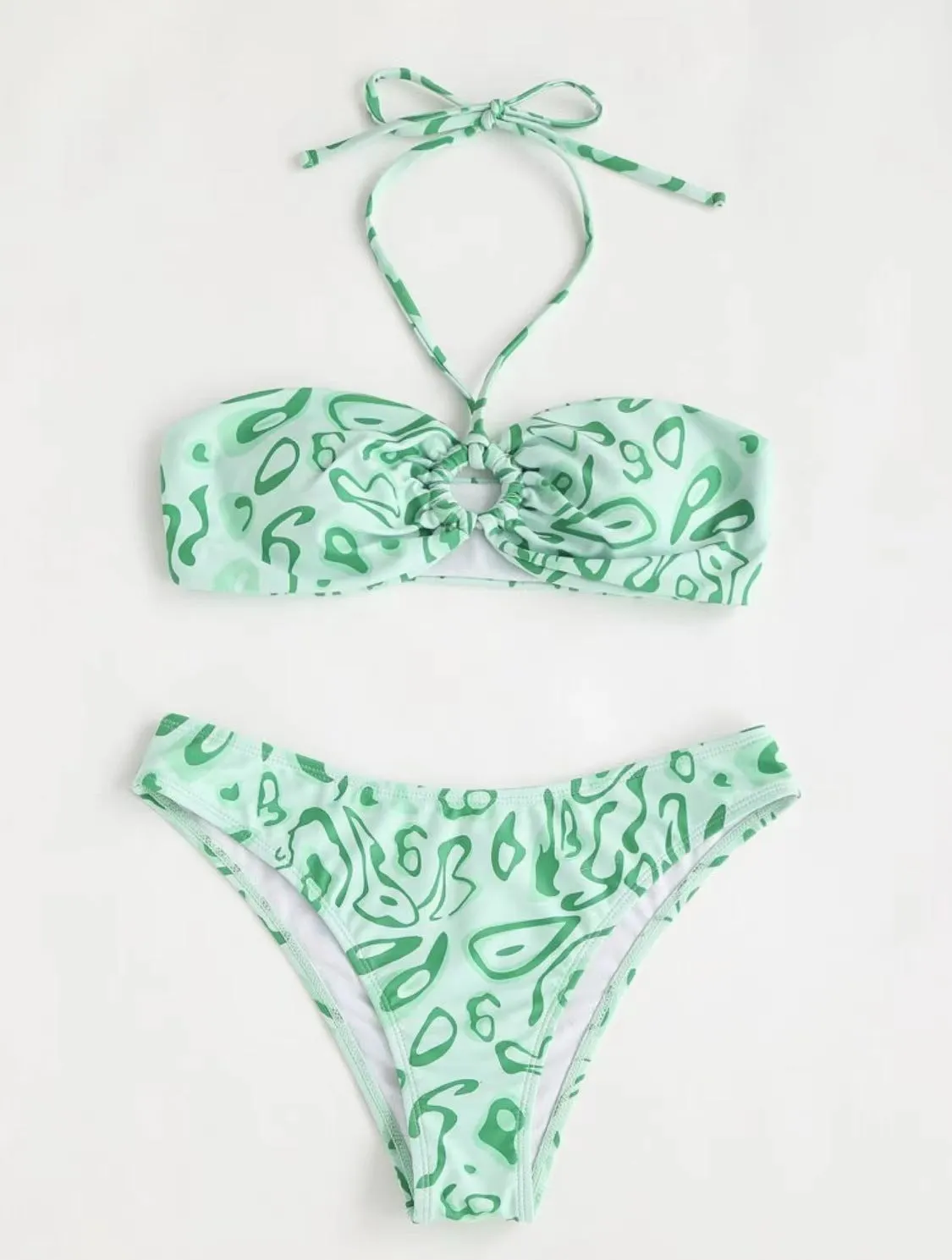 Women's blue floral bandeau bikini swimsuit with split style design on mannequin
