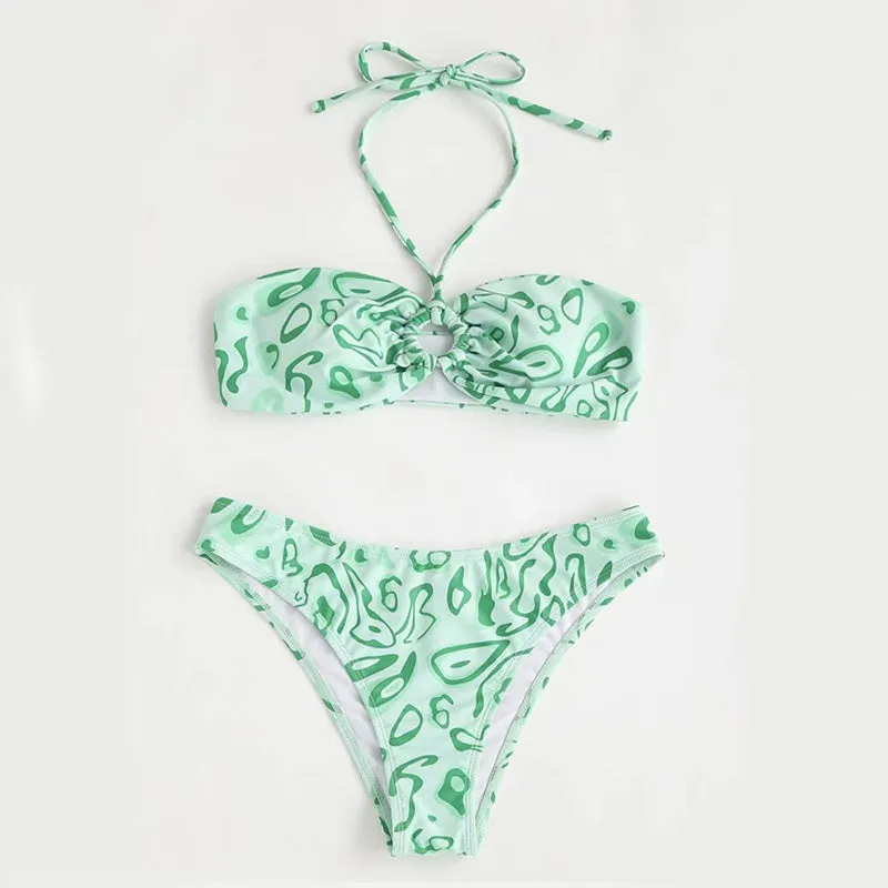 Women's blue floral bandeau bikini swimsuit with split style design on mannequin
