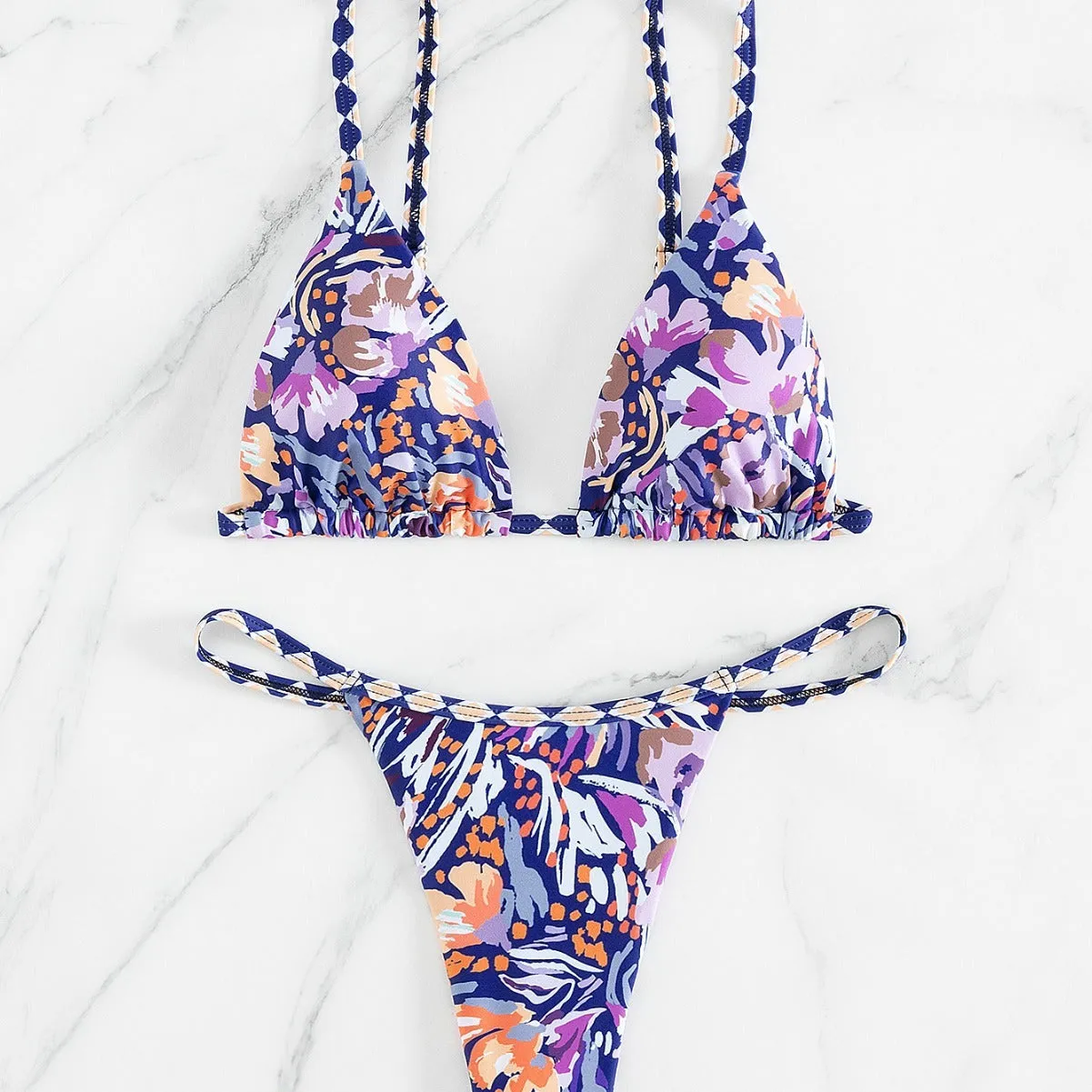 Women's floral print triangle bikini with tie-back and split-front polyester briefs.