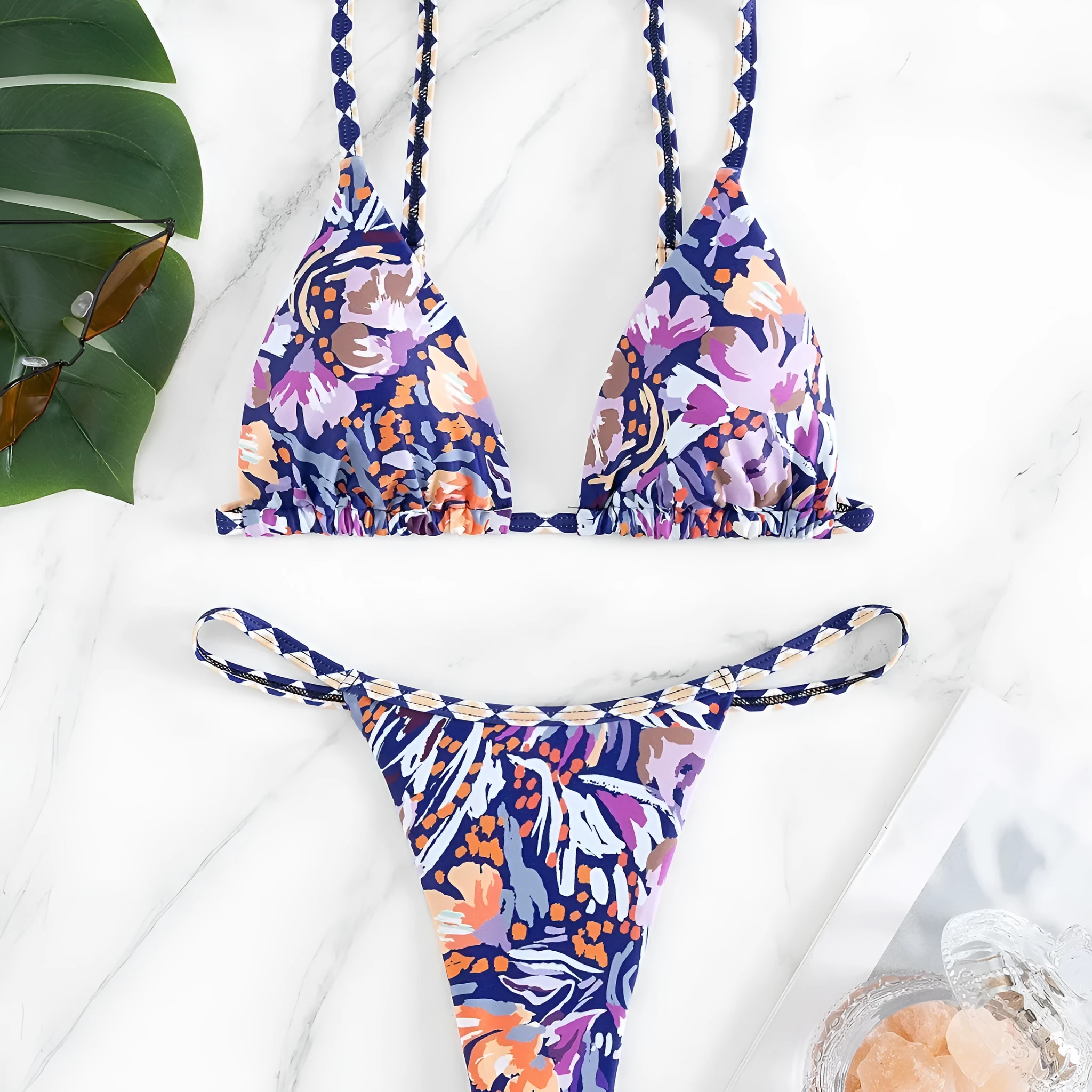 Women's floral print triangle bikini with tie-back and split-front polyester briefs.