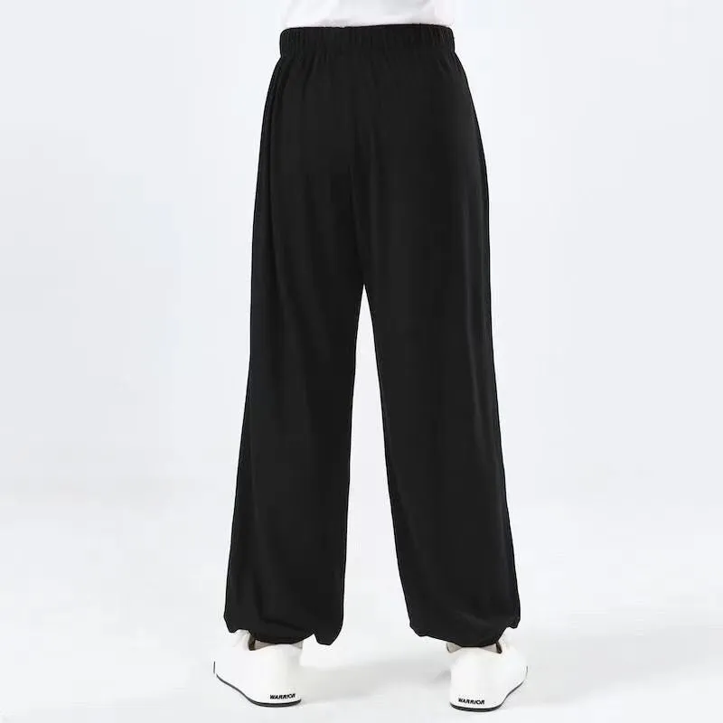 Children's black high elasticity Sanda practice pants made from Lycra fabric for martial arts training.