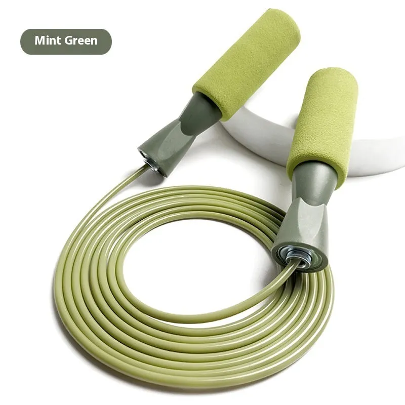 PVC bearing wire rope fitness skipping rope in peacock blue with handles on a plain background