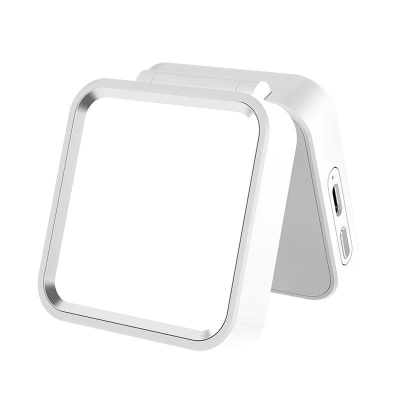 Clip-on LED camping lantern in black, clipped onto a bag, with rechargeable light for night use