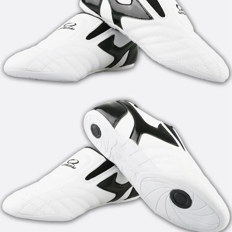 Black and white children's Sanda Taekwondo martial arts shoes with a soft sole and widened fit.