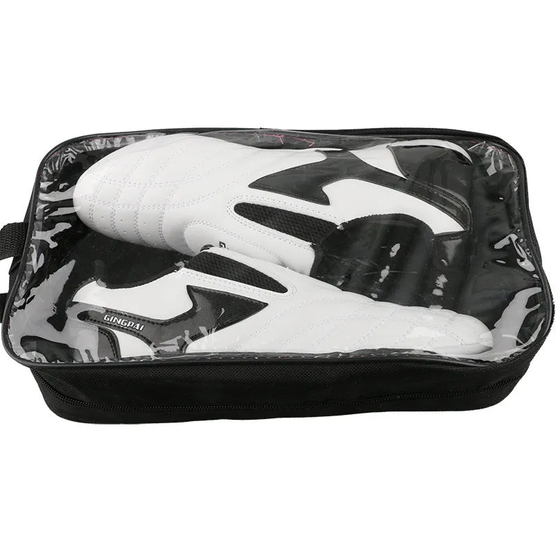 Black and white children's Sanda Taekwondo martial arts shoes with a soft sole and widened fit.