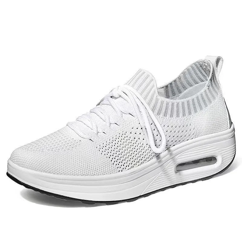 Women's mesh low-top air cushion thick sole breathable shoes in white with rubber soles showing side view