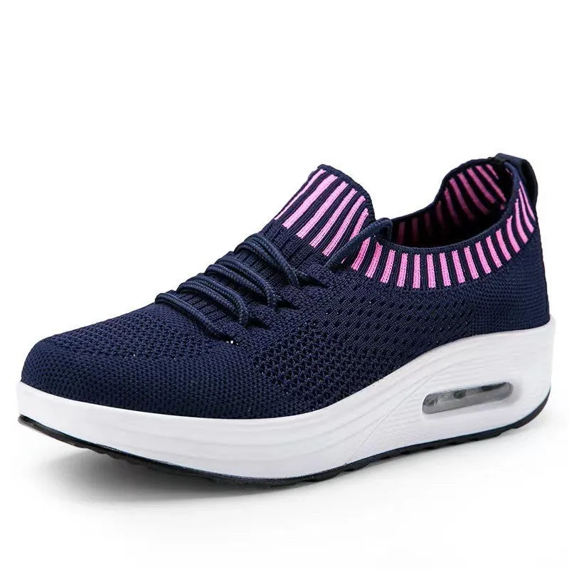 Women's mesh low-top air cushion thick sole breathable shoes in white with rubber soles showing side view