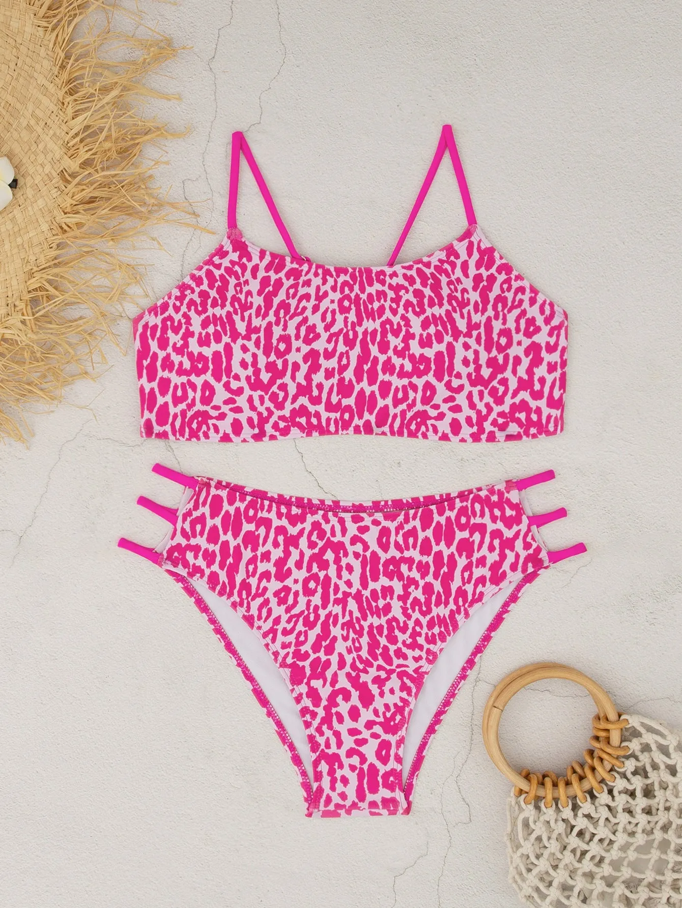 Two-piece leopard print bikini swimsuit with multi-rope detail, polyester, sizes S to XL, in blue and pink leopard colourways