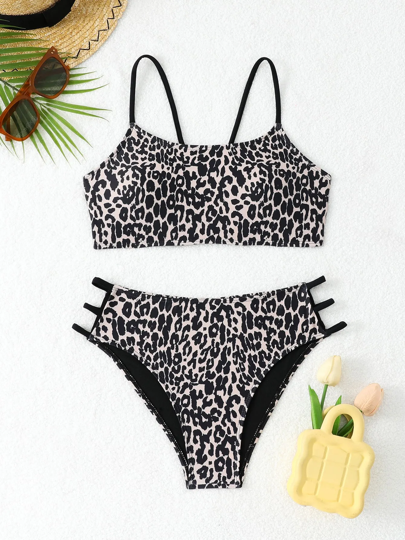 Two-piece leopard print bikini swimsuit with multi-rope detail, polyester, sizes S to XL, in blue and pink leopard colourways