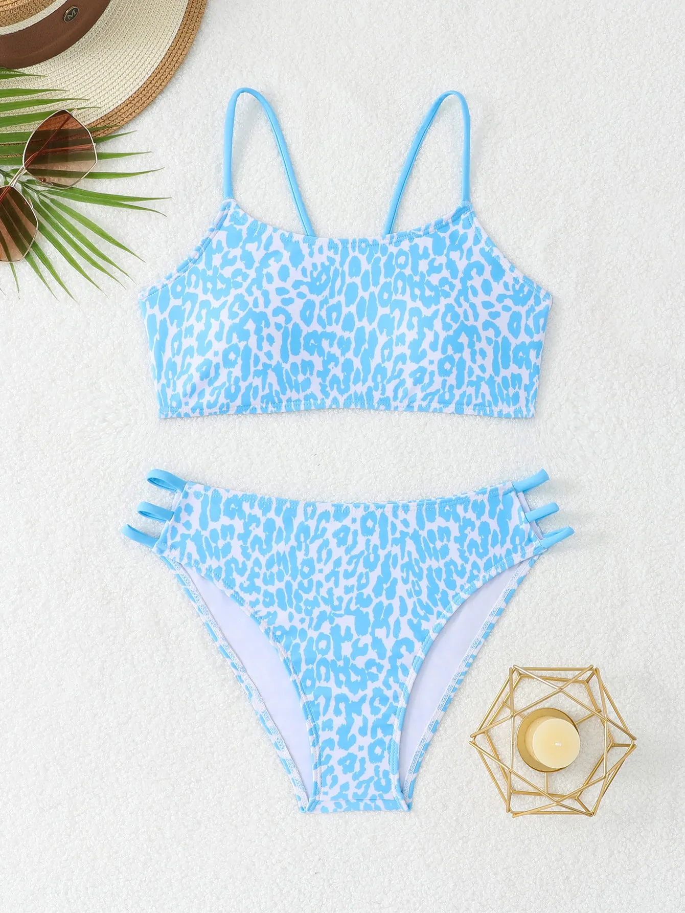 Two-piece leopard print bikini swimsuit with multi-rope detail, polyester, sizes S to XL, in blue and pink leopard colourways