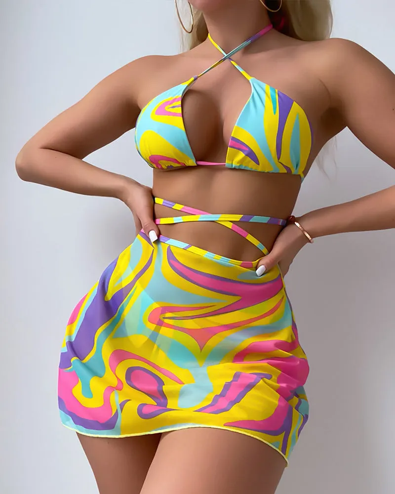 Yellow striped women's halter swimsuit with lace-up front, worn with matching skirt and shorts.