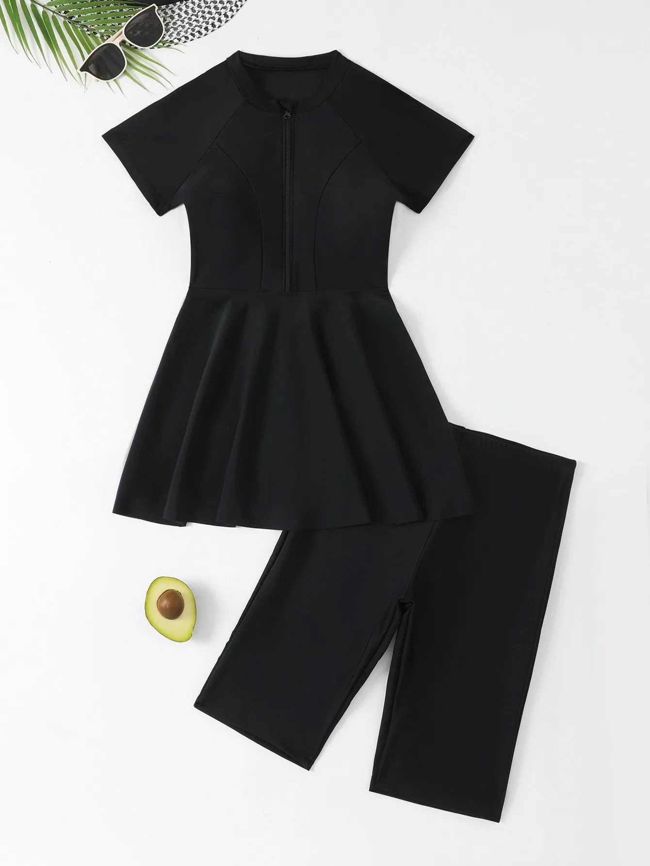 Women's black split two-piece swimsuit with short sleeves, shorts, and zipper front for sun protection.