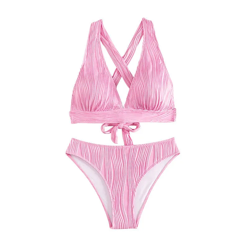 Women's pink halter strap bikini top and shorts swimsuit set on a mannequin.