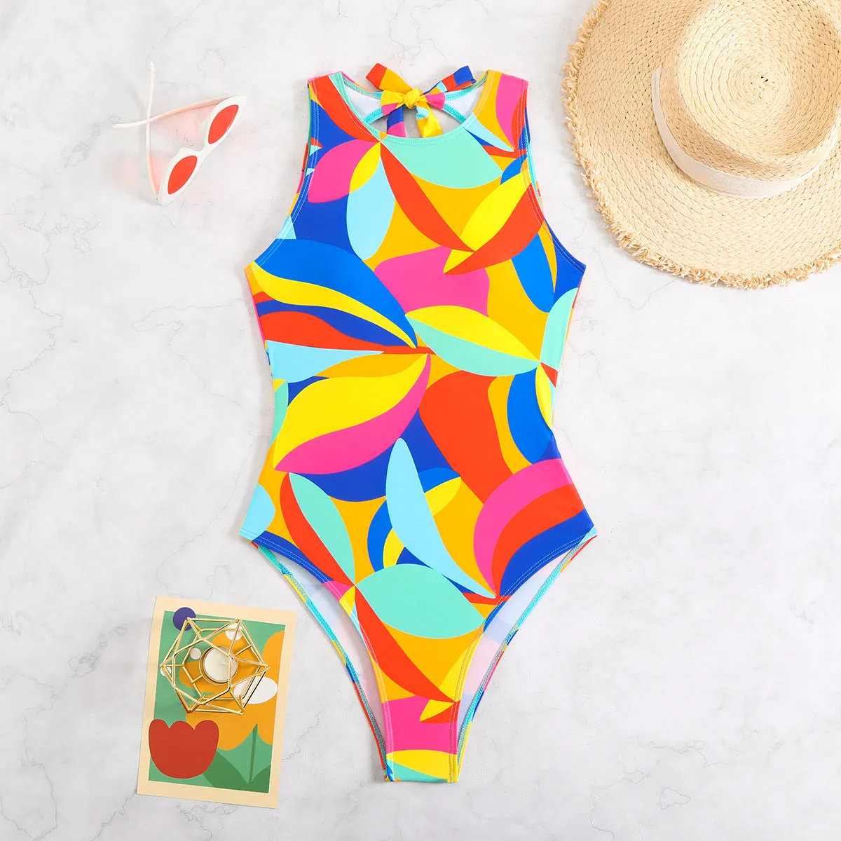 Women's multi-colour printed one-piece swimsuit, tight fit, available in sizes S M L XL, black colour option