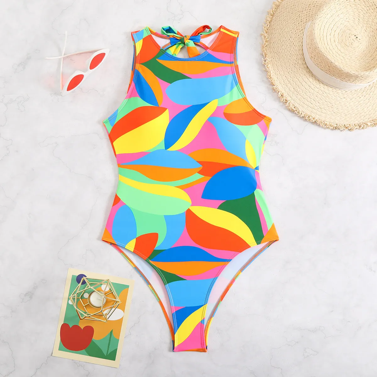 Women's multi-colour printed one-piece swimsuit, tight fit, available in sizes S M L XL, black colour option