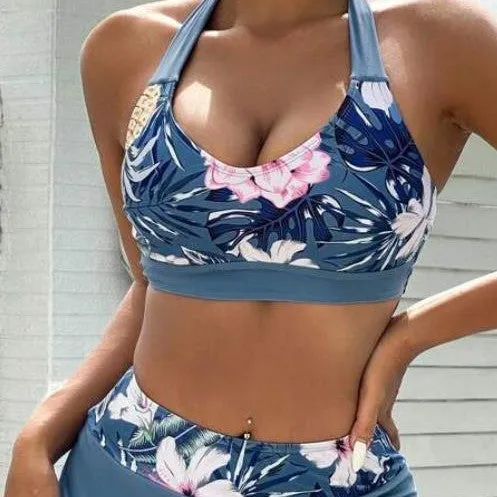 Women's blue solid colour lace-up bikini three-piece set with bra, skirt, and underwear on model