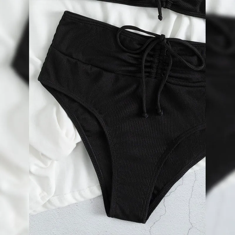 Black women's high waist bikini swimsuit with sling split design showing front view