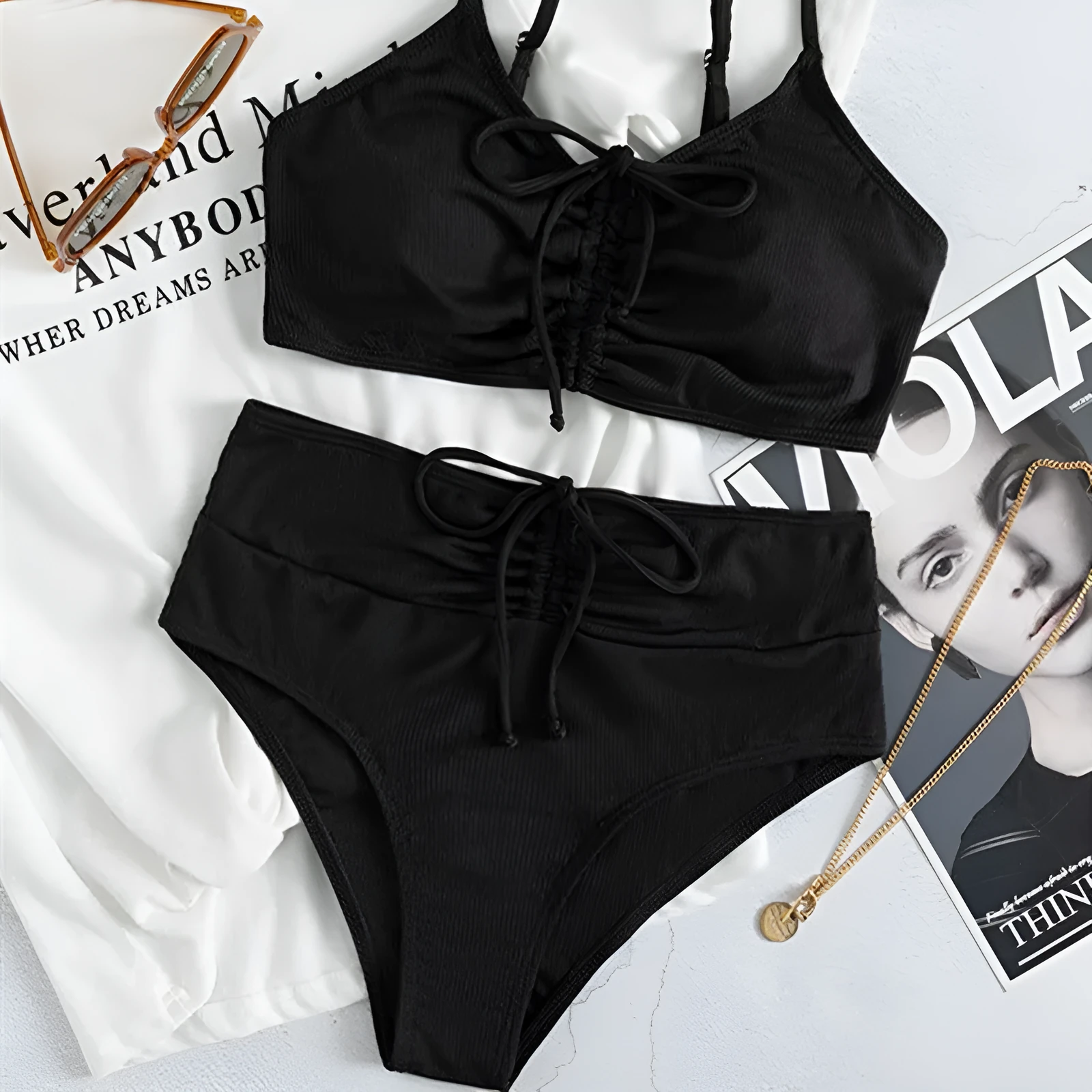Black women's high waist bikini swimsuit with sling split design showing front view