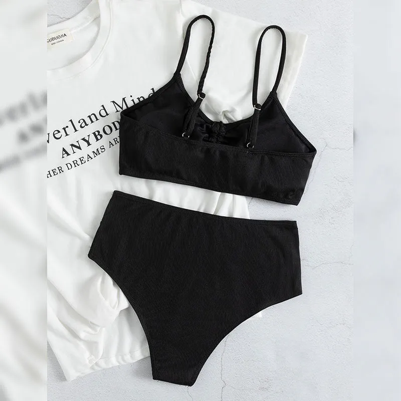 Black women's high waist bikini swimsuit with sling split design showing front view