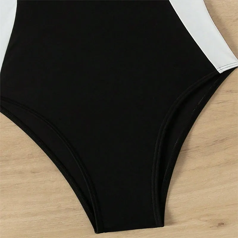Black and white women's one-piece swimsuit with pearl spaghetti straps and slim-fitting design