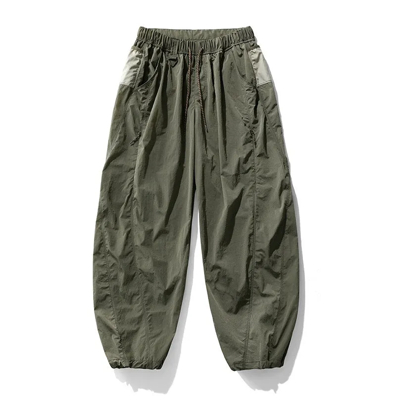 Fleece-lined quick-dry paratrooper cargo pants in army green with cargo pockets and adjustable cuffs