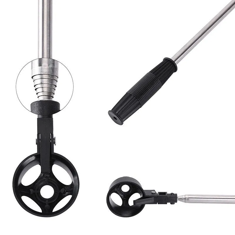 Black stainless steel retractable golf ball retriever with plastic head on golf course