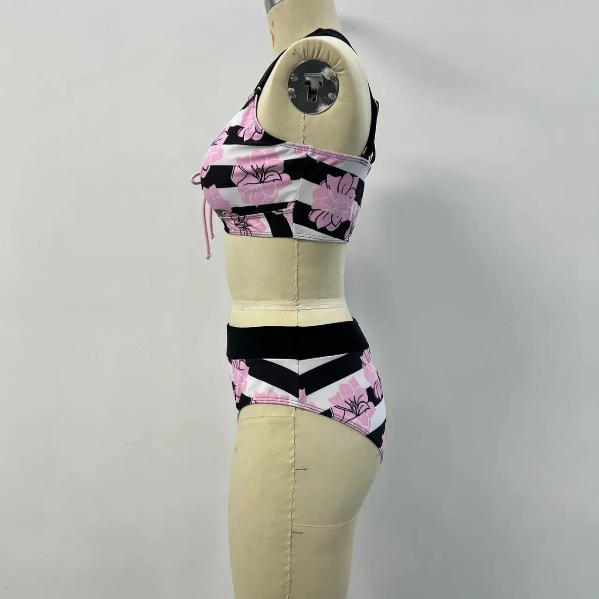 Black women's split bikini with printed belly coverage design for swimming