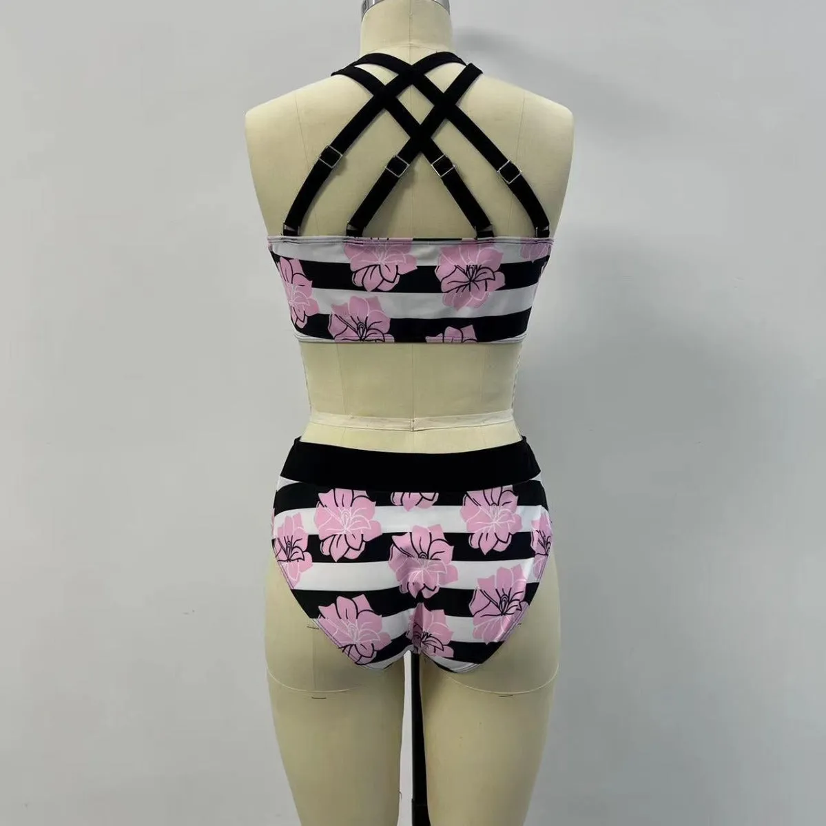 Black women's split bikini with printed belly coverage design for swimming