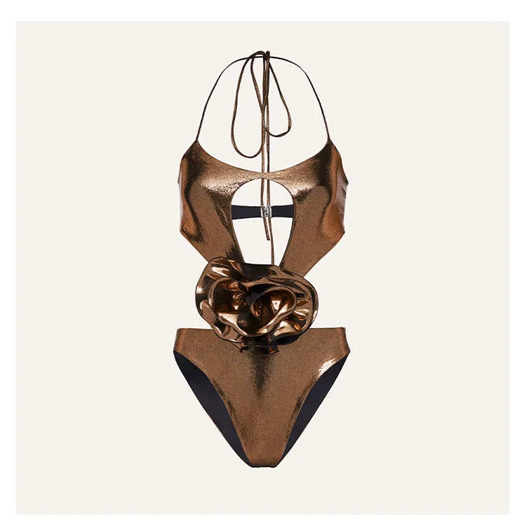 Gold coloured halter neck one piece swimsuit with a handmade hollow out flower design on the front.