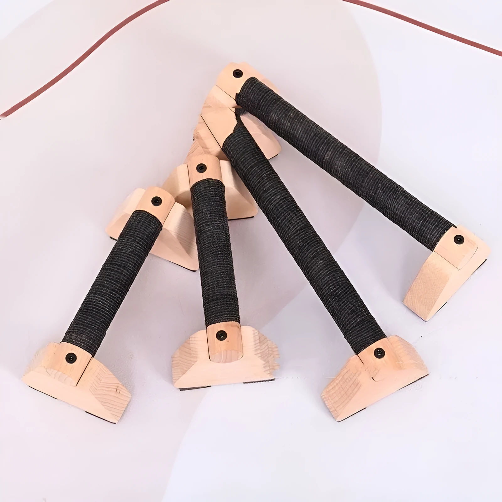 Two solid wood single parallel bars on a floor, one beech and one rubber wood, for home fitness training