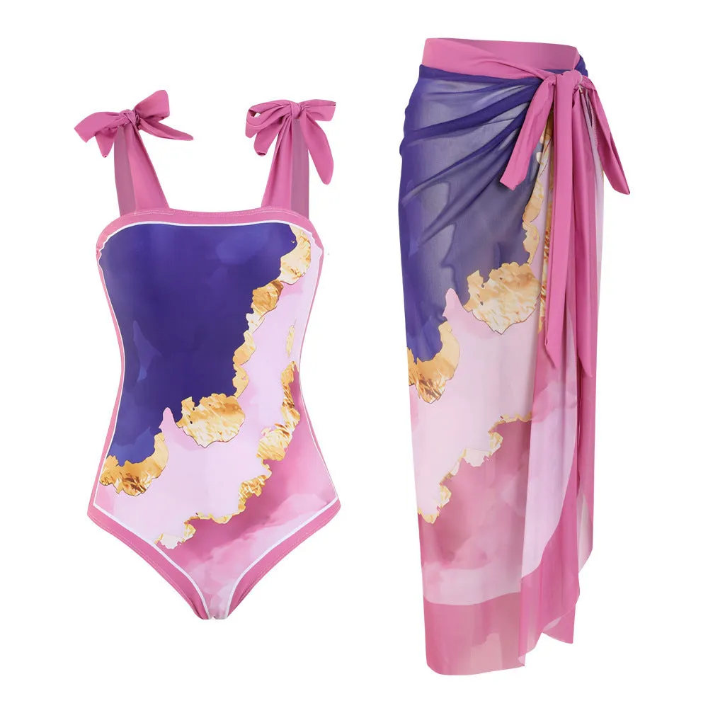 Floral print conservative one-piece swimsuit with mesh tube top and matching skirt.