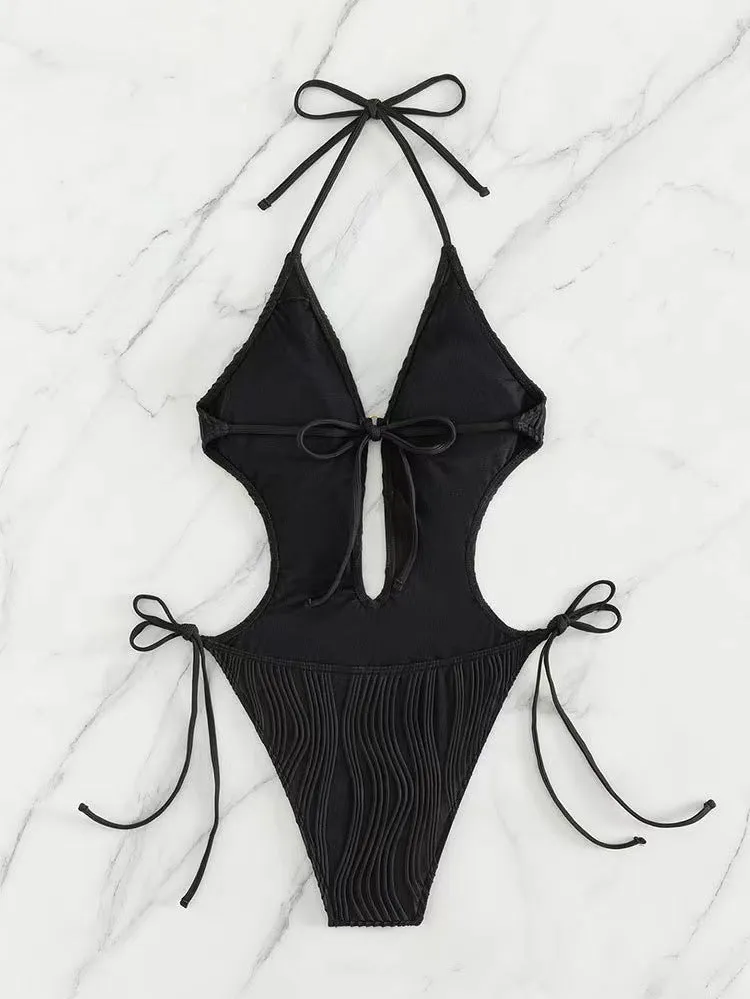 Women's black lace-up triangle bikini swimsuit on mannequin showing adjustable top details