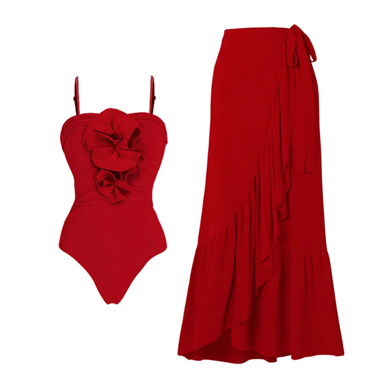 Red women's halter neck one-piece swimsuit with detachable long skirt, showing V-neck and open back design.