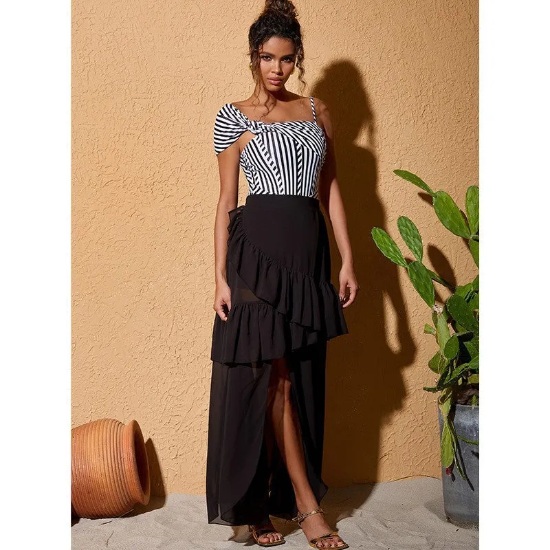 Women's striped one-piece swimsuit with black ruffled skirt detail for swimming and beachwear