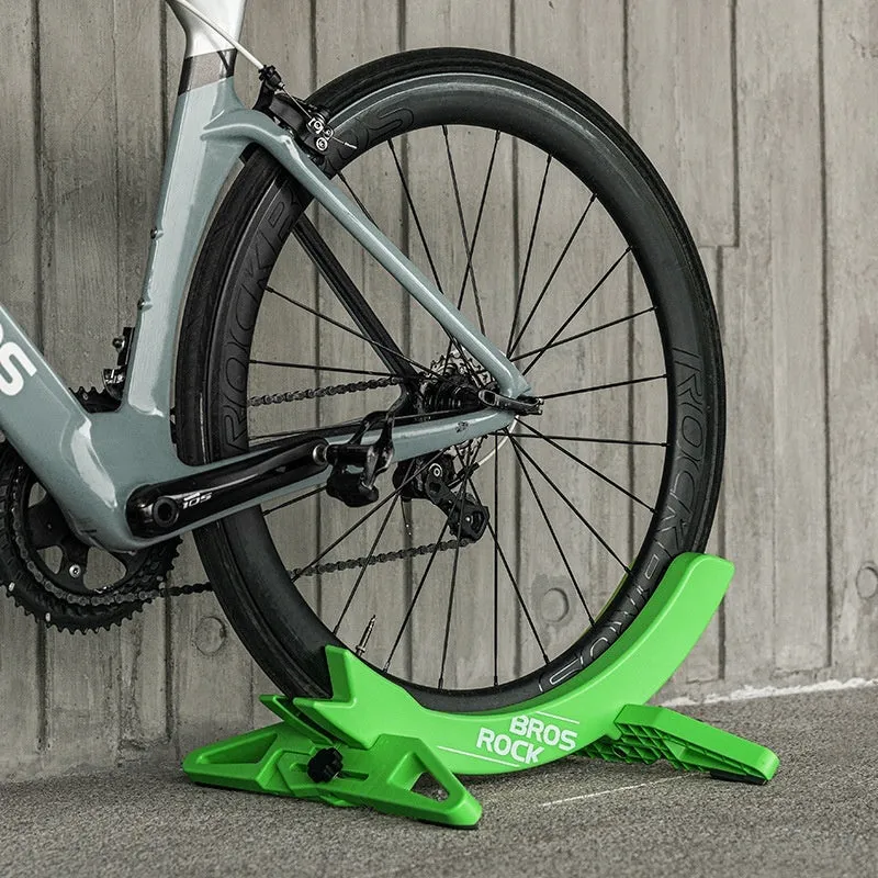Black and green ABS plastic bicycle parking rack holder for road and mountain bikes