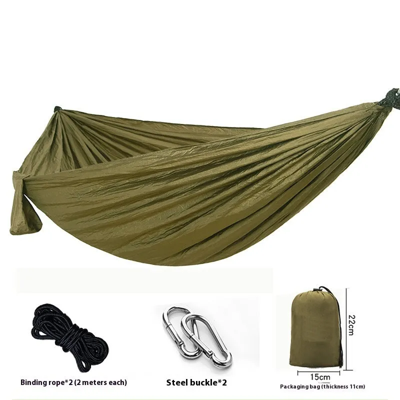 Parachute cloth camping hammock in 210T nylon hanging between trees with included ropes and buckles