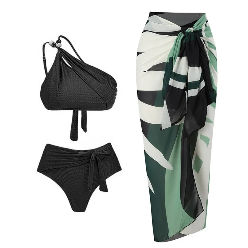 Women's brown push up high waist swimsuit with a split brief design and a sheer black chiffon dress overlay.